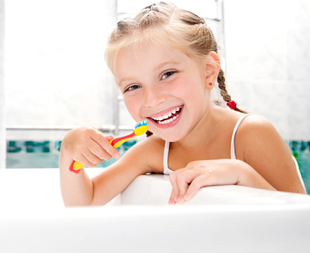 child brushing teeth